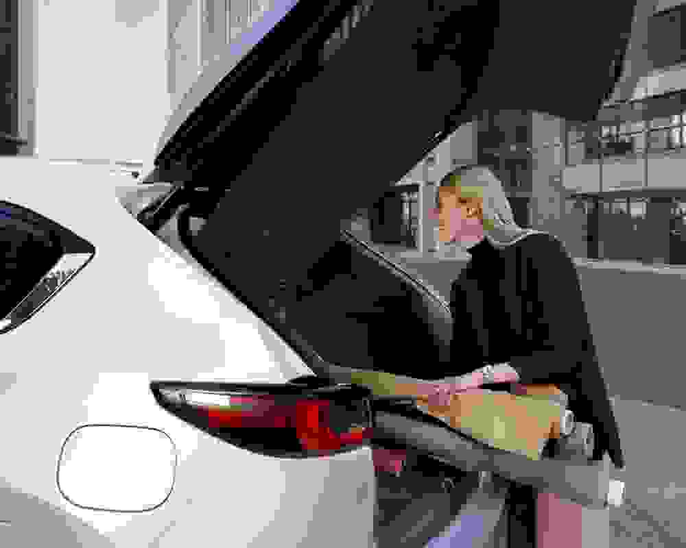 Woman enjoying tailored car loan rate with Mazda GFV